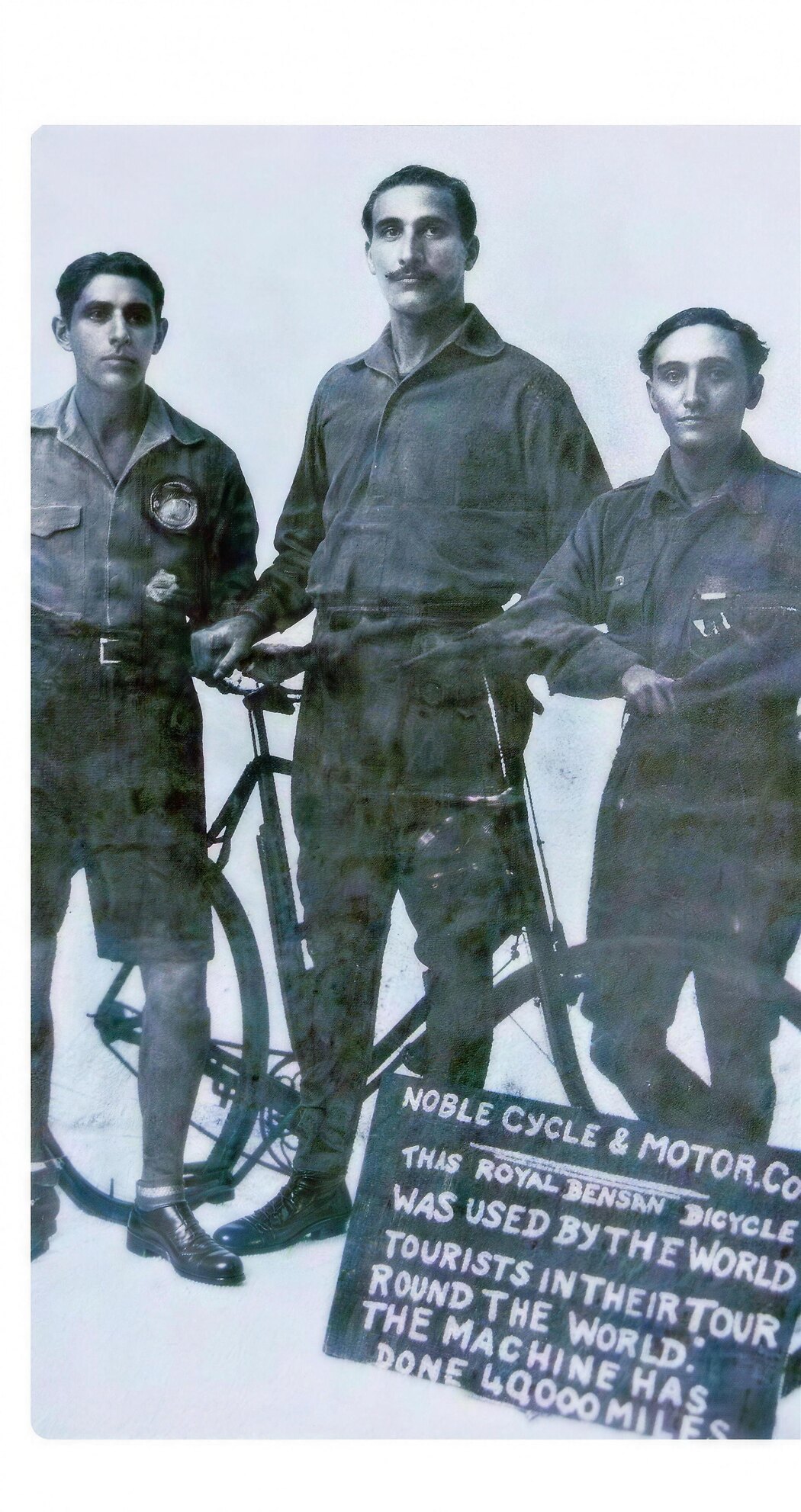 Adi Hakim, Jal Bapasola and Rustom Bhumgara home in Bombay with the bicycle whose painted board reads, the machine has done 40,000 miles round the world