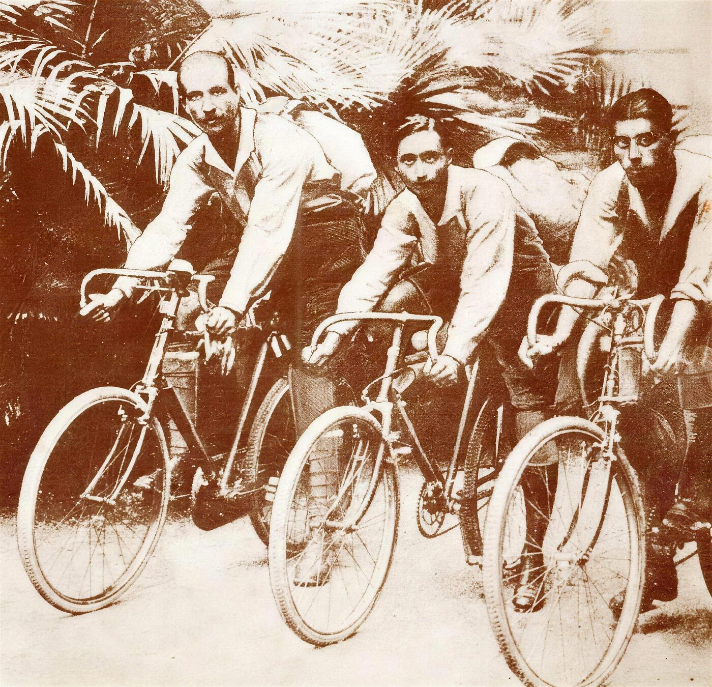 Left to right, Jal Bapasola, Rustom Bhumgara and Adi Hakim cycling on their Royal Benson bicycles